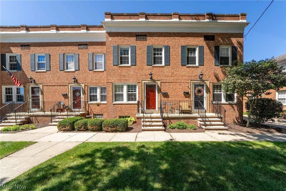 Brick front exterior, entry steps and lawn at 2684 Wooster Road