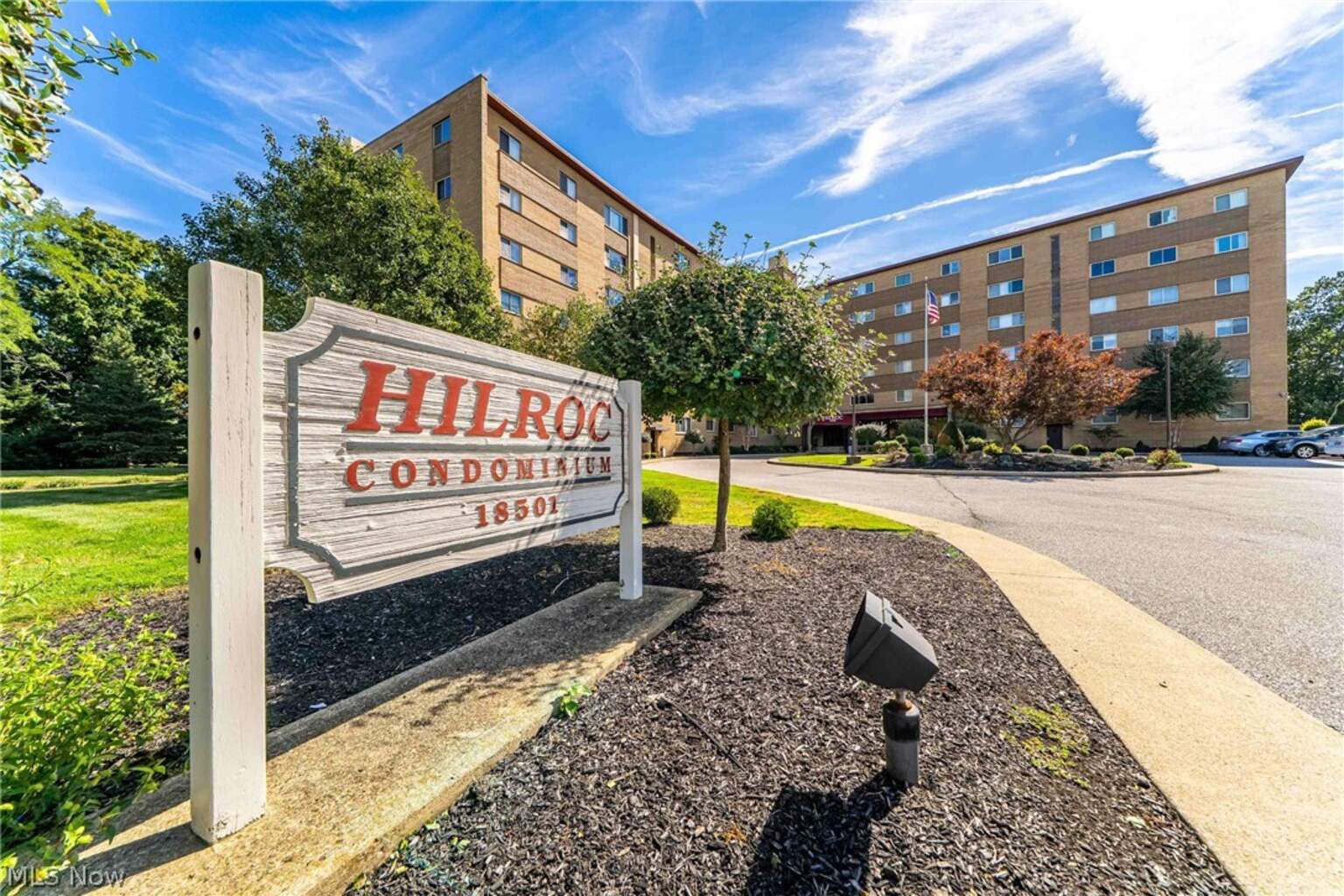 Hilroc Condos sign and brick condominium building at 18501 Hilliard Boulevard