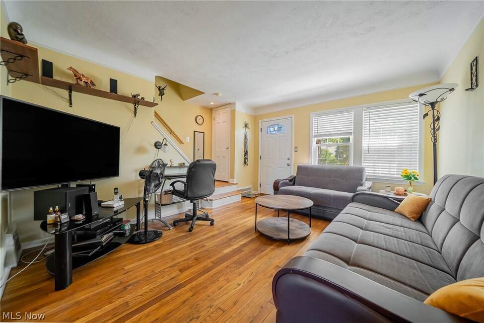 Living room with sofa, windows and front door
