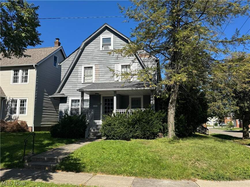 Front exterior, porch and lawn at 3633 Cedarbrook Road in University Heights