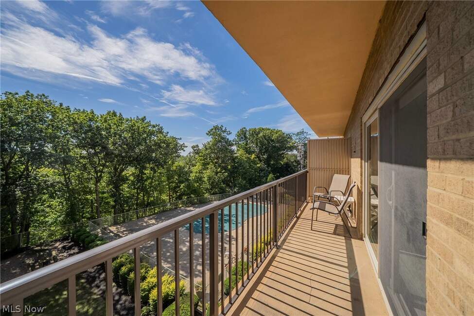 Private balcony at Unit 413 overlooking mature trees