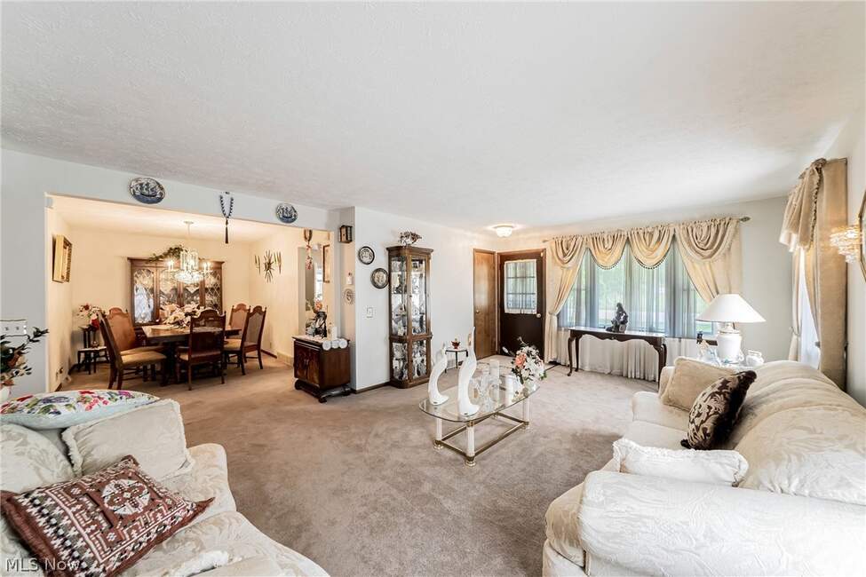 Living room opening toward dining area