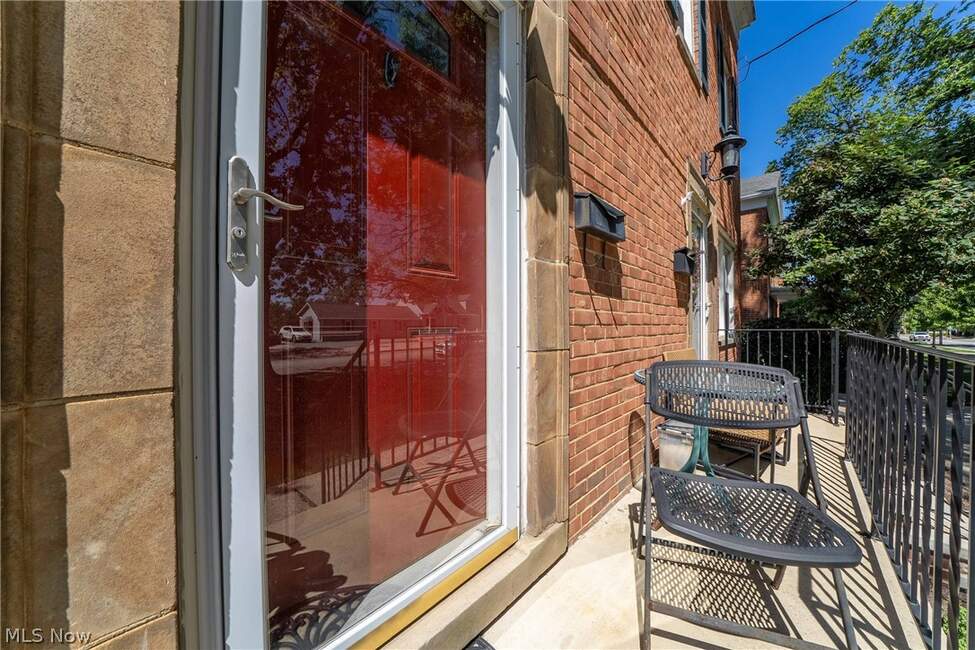 Front porch and red entrance door