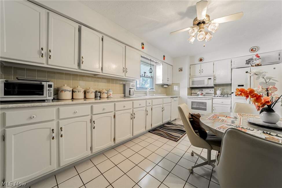 Repainted kitchen cabinetry and counters