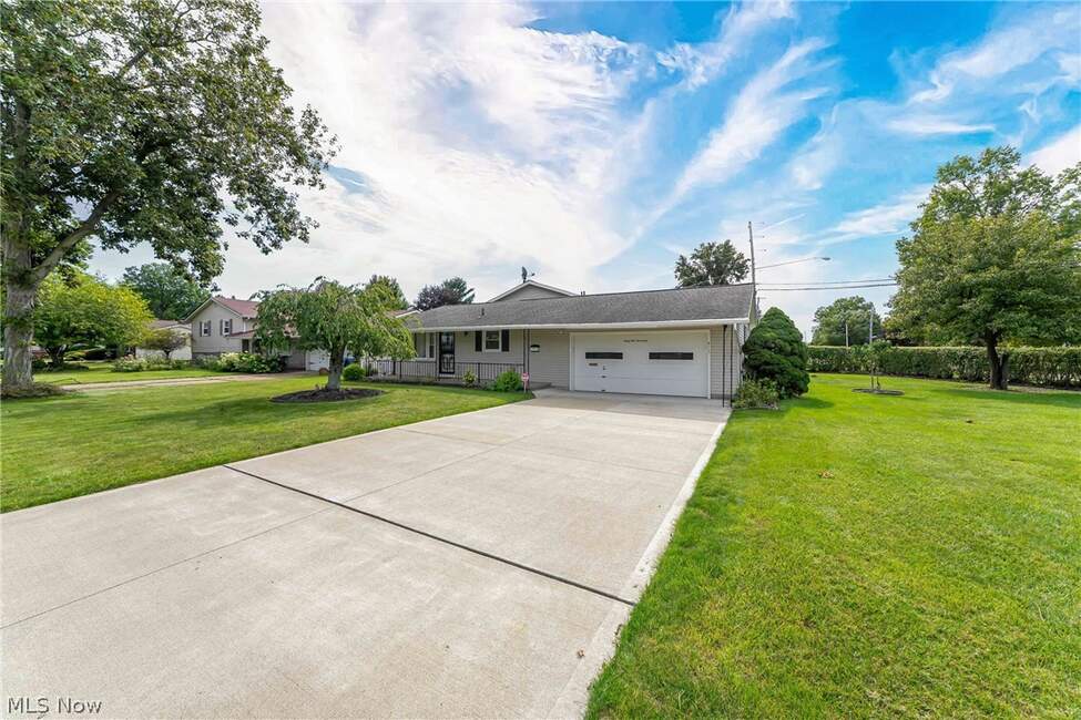 Concrete driveway leading to the attached two-car garage at 6117 Yorktown Road